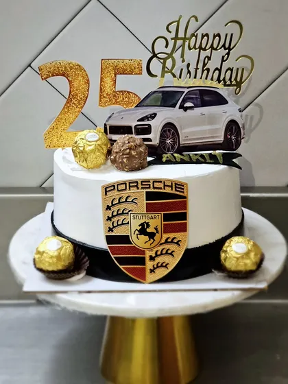 A sleek Porsche-themed cake for a 25th birthday. This design is perfect for car enthusiasts, topped with Ferrero Rocher for that extra touch of luxury.