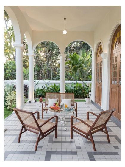The outdoor veranda of the Loto Bianco villa in Goa, designed to embrace tropical living. I used restored antique Goan furniture and patterned cement tiles to create an inviting space that blurs the line between indoors and out.