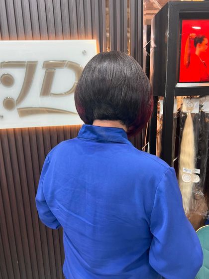 A back view of a chic bob haircut, showing the precise shape and graduation.