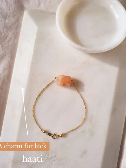 My 'haati' elephant bracelet in peach moonstone. This charm is for new beginnings, inner growth, and strength. It's wonderful for soothing emotional instability and stress.