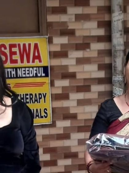 A woman receives a blanket with a smile. These moments of gratitude fuel our passion for community service.