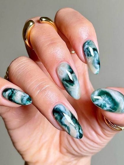 Another look at the beautiful green quartz nail art. The depth and variation in the marble pattern make each nail unique, just like a real gemstone.