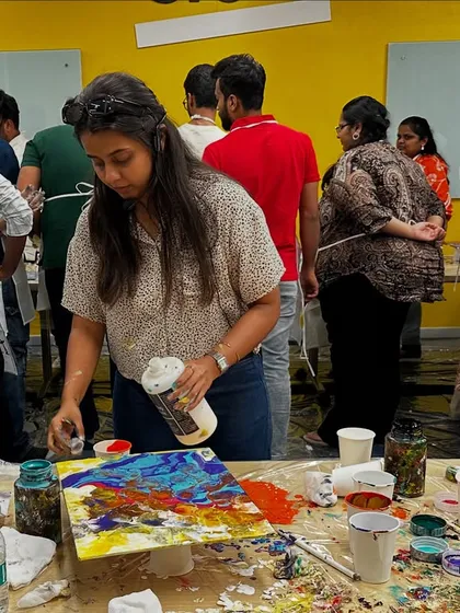 This is what creative chaos looks like, and I am here for it. A fluid art workshop is perfect for teams that want to let loose, get a little messy, and create something totally abstract and beautiful without needing any "art skills."
