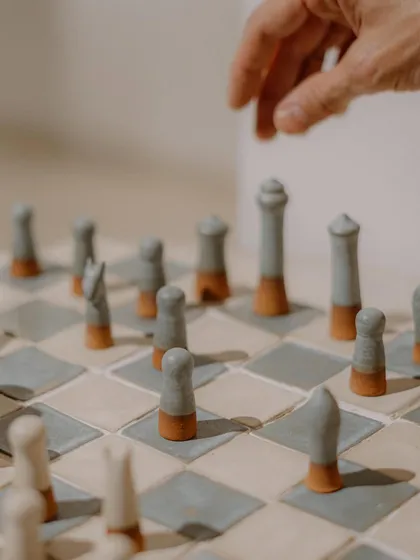 Art can also be playful. I loved the challenge of creating this complete ceramic chess set, where each piece is hand-sculpted and the board is made of custom-glazed terracotta and stoneware tiles.