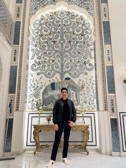 Standing before a beautiful piece of traditional Rajasthani art in Jaipur. The city's rich culture and artistic heritage are a constant source of inspiration.