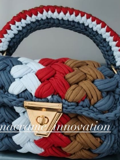 This multi-color crochet puff bag has a patriotic feel with its red, white, and blue tones, mixed with earthy brown and grey.