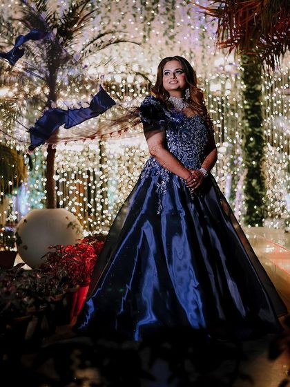 A beautiful shot of the bride against a backdrop of fairy lights, creating a magical atmosphere.
