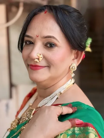 Another happy client, looking graceful and elegant in her traditional attire.