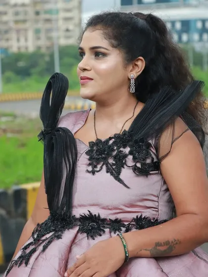 A creative hairstyle and makeup look on this model, showing the versatility of our students.