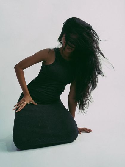 Capturing the peak of a hair flip, this shot is all about high energy and drama.