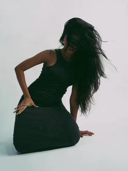 Capturing the peak of a hair flip, this shot is all about high energy and drama.