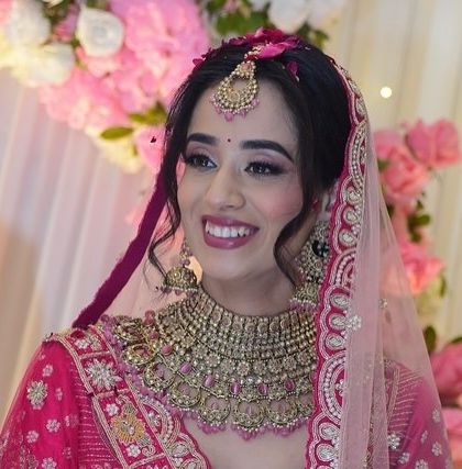 Shivangi looked absolutely radiant for her day wedding. I created a minimal makeup look that embraced her natural glow and paired it with her beautiful pink lehenga.