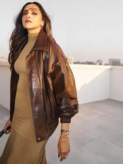 Deepika Padukone looking powerful and chic. Her hair is styled with a voluminous blowout, giving it movement and life that pairs perfectly with her edgy, fashionable look. We also provided our signature chocolate brown nails.