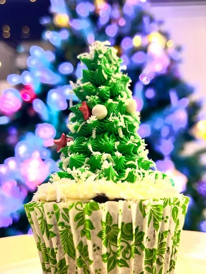 Sweeten your holidays with our festive Christmas muffins. This one is decorated to look like a Christmas tree, complete with frosting branches and sprinkle ornaments.