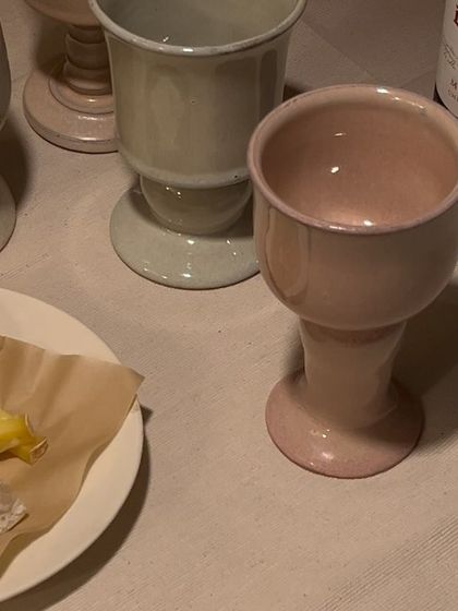 Another view of the goblets on the table, paired with cheese and fruit. They are versatile pieces, perfect for wine, cocktails, or even water.