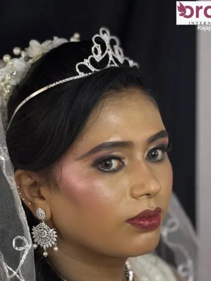 A close-up of the Christian bridal look, showing the soft pink blush and glossy lips that create a fresh and radiant appearance.