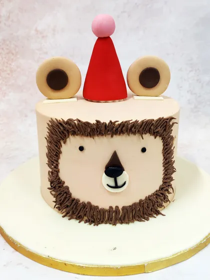 A frontal view of the simple lion cake, showing its charming and understated design.
