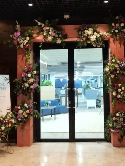 A grand entrance sets the tone for your entire event. For the Columbia Sportswear office opening, we created this lush floral archway, seamlessly integrating their brand's welcoming message with an elegant and impressive design that greets guests from the moment they arrive.