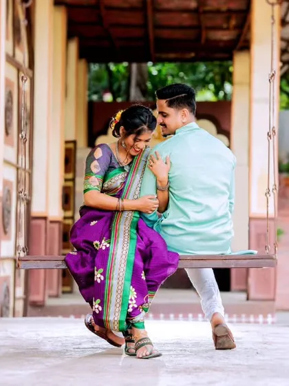 Laughter and love on a traditional swing. This image beautifully captures a candid, unposed moment that feels authentic and full of happiness.