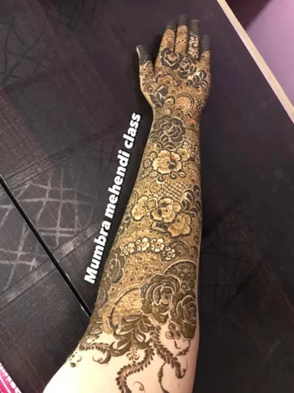 Look at the detail in this full-arm bridal design. We cover everything from floral motifs to delicate netting, or 'jaali' work, in my advanced lessons.