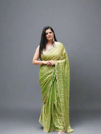 A full-length pose in the lime green organza tissue saree, perfect for any celebration where you want to look effortlessly chic.
