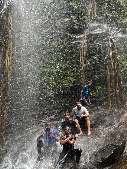 Friends enjoying a natural slide on the rocks at Hidlumane Falls. We always find ways to have fun.