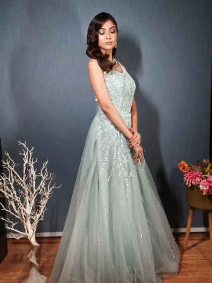 A graceful shot of the model in the mint green gown.