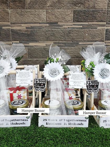 Celebrating 25 years of togetherness with these elegant Silver Jubilee anniversary hampers. The white and silver theme looks so classy and beautiful.