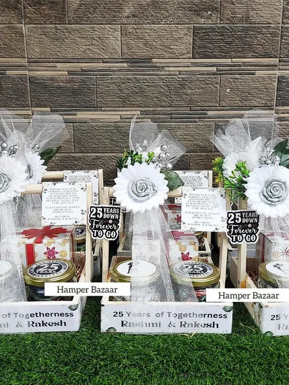 Celebrating 25 years of togetherness with these elegant Silver Jubilee anniversary hampers. The white and silver theme looks so classy and beautiful.