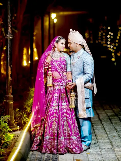 A classic couple portrait on a beautifully lit pathway.