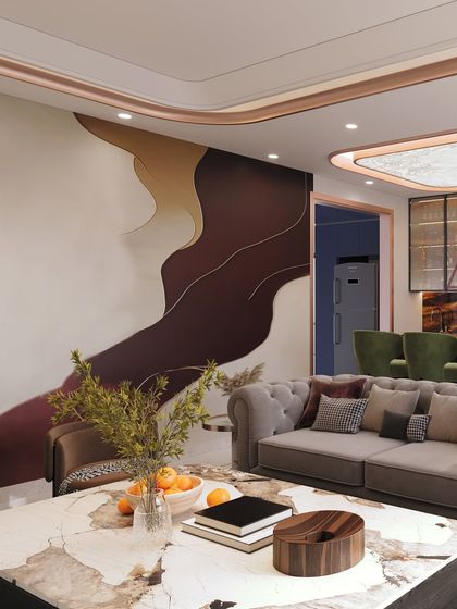 A living space defined by a bold, abstract wall mural in earthy tones, paired with classic tufted sofas and a modern marble coffee table.