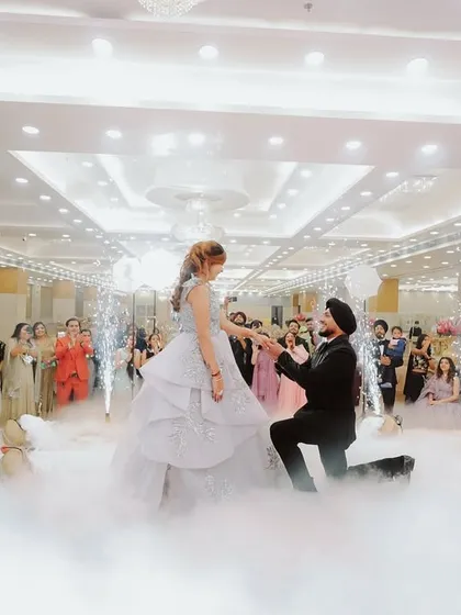 That picture perfect proposal moment, complete with smoke effects and the cheer of loved ones. I specialize in capturing the peak emotions of your engagement day, creating a memory you will cherish forever.