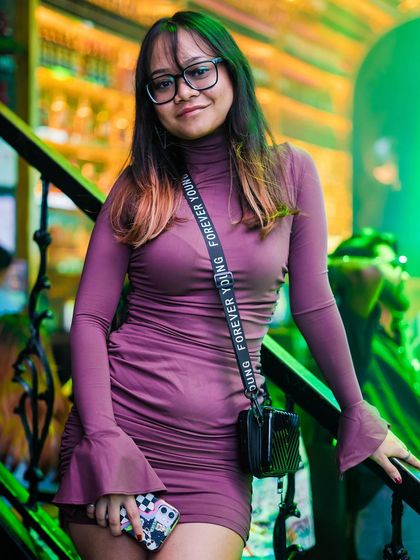 A guest posing on the stairs.