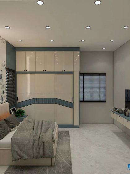 A bedroom with a cool blue and white color scheme, featuring a floral wallpaper accent and a modern two-tone wardrobe.