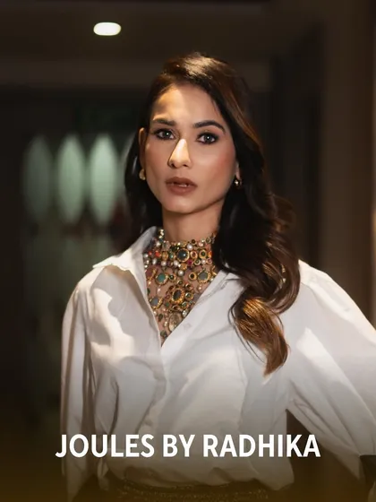 A full-length shot showcasing Aneri Vajani's unique styling of our traditional necklace with a modern, chic outfit.