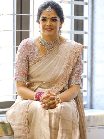 Photos from my housewarming, wearing a saree and blouse I designed myself. I took a plain tissue saree and completely transformed it with a hand-worked scalloped border and a custom-stitched velvet blouse. It’s a look that’s very close to my heart.