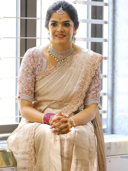 Photos from my housewarming, wearing a saree and blouse I designed myself. I took a plain tissue saree and completely transformed it with a hand-worked scalloped border and a custom-stitched velvet blouse. It’s a look that’s very close to my heart.
