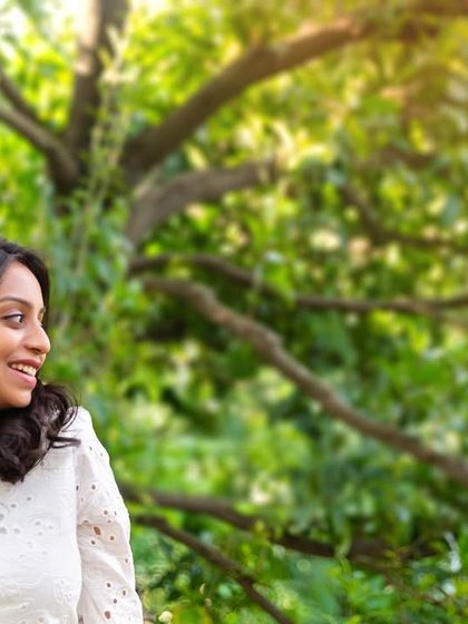 A candid, happy smile. This close-up portrait captures the pure joy and anticipation of motherhood, all within the familiar and comfortable setting of her own home.
