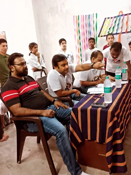 The examination panel is getting ready. We take the grading process very seriously to maintain the high standards of Kyokushin karate.