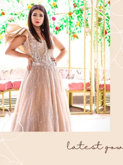 A breathtaking gown that captures timeless beauty. This beige gown with silver work is pure elegance.