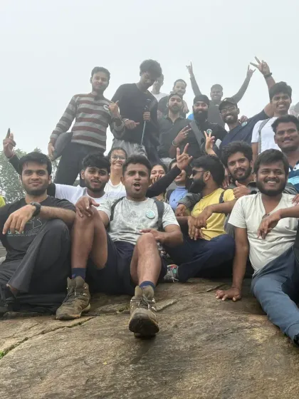 Relaxing on a rock formation at the summit. After the hard work of the climb, it's time to enjoy the view and the company.