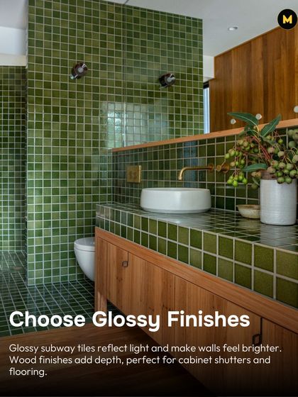 In a small bathroom, choose glossy finishes. Glossy subway tiles reflect light and make walls feel brighter. Pairing them with wood finishes on the cabinets adds warmth and depth.