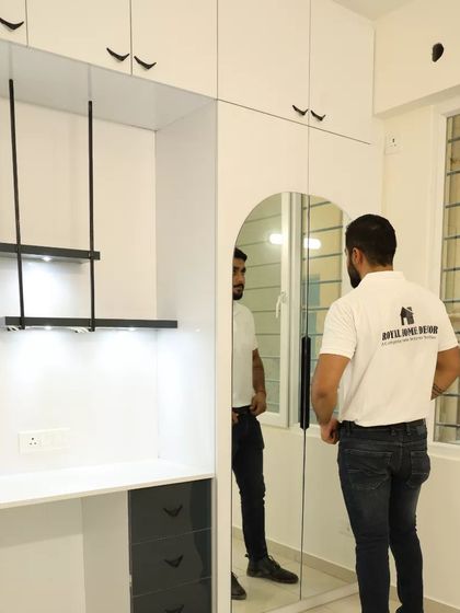 A study unit with a mirrored wardrobe door, a clever way to combine functionality and make the room feel larger.