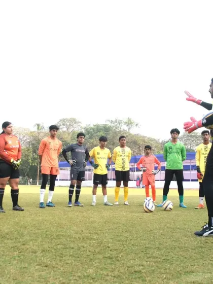 An instructor addresses a group of goalkeepers from our Super Division, U-16, and U-18 Men's teams. Our clinics are structured to cater to the specific needs of athletes at different levels of competition.