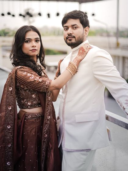 A chic and modern pose from an engagement shoot, showcasing the couple's style.