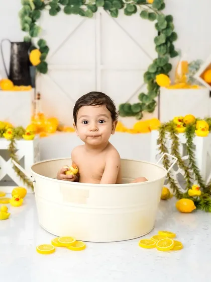 Making a funny face for the camera! I love capturing all the silly, candid moments during these one-year-old milestone sessions.