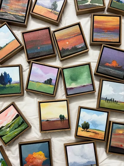 I create these miniature landscape paintings as small windows into vast, quiet worlds. Each tiny canvas, from rolling green hills to dramatic sunset clouds, is a moment of scenery captured and framed to bring a sense of peace to any space.