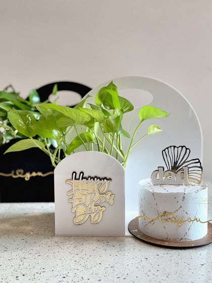 Here are my two Father's Day hamper options side-by-side. You can choose between a black or white acrylic plant holder to go with a custom-designed half-kg cake.