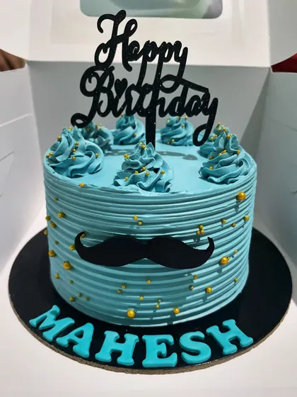 A fun and stylish cake for him, this design features a cool blue frosting with a comb texture and a bold black mustache. It's a simple, modern, and playful choice for a man's birthday.