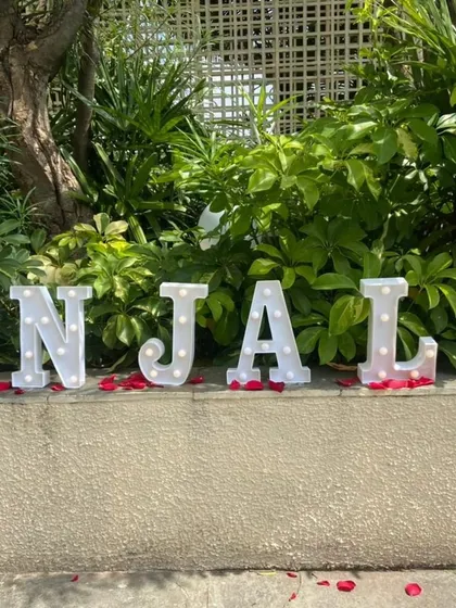 Add a personal touch with custom marquee letters spelling out a name. This was part of a romantic birthday surprise, creating a beautiful and illuminated focal point.